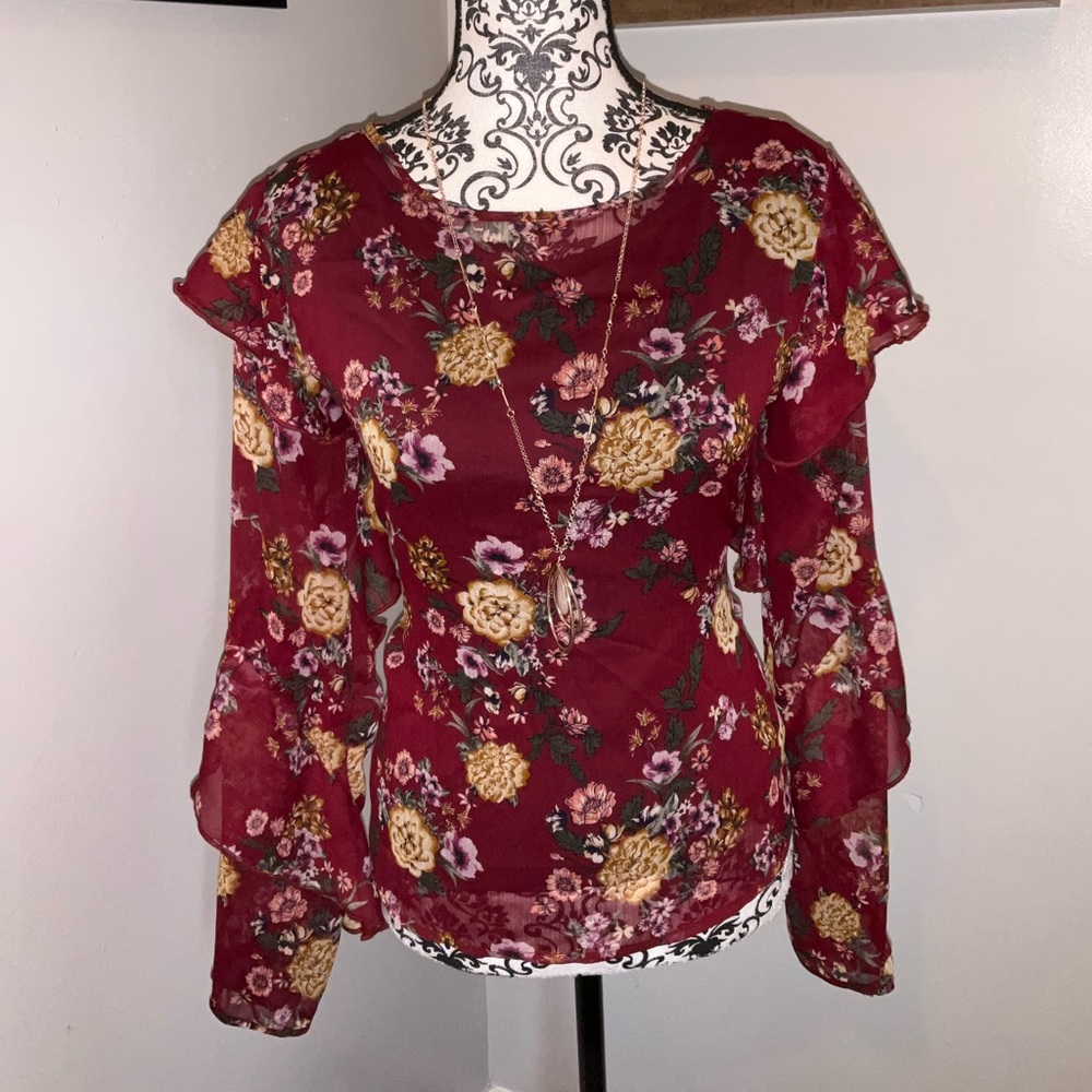 Long sleeve ruffle blouse.